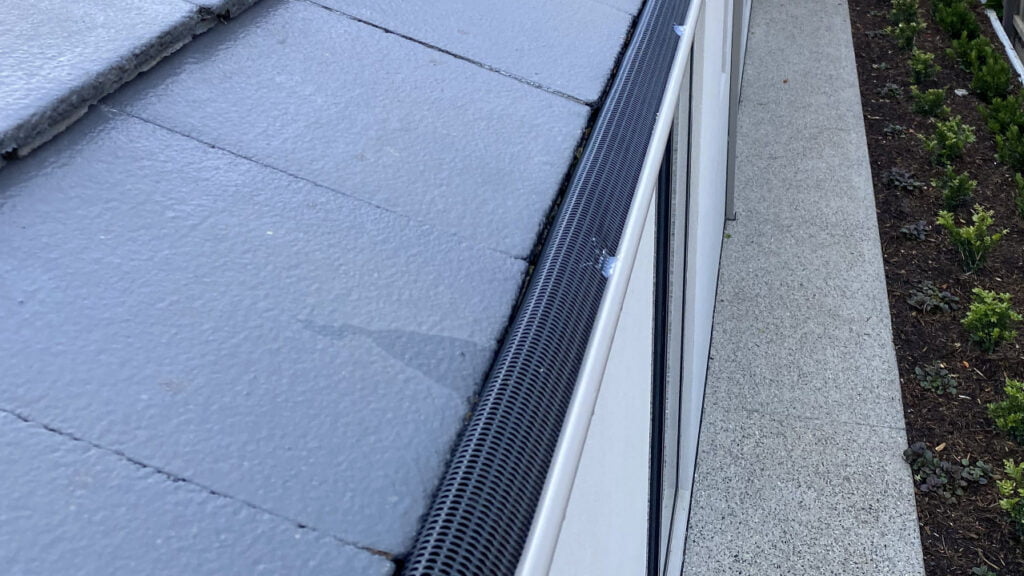 Rolled-in Gutter Guard System